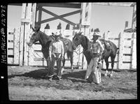 Bob and Hank Christensen standing by Horses