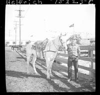 Jim Bob Altizer  (Pose) standing by horse