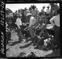 Don Wilson standing behind chutes in group of contestants