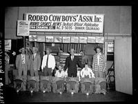 Cowboy Champs in front of Booth