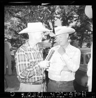 Reporter interviewing Devere Helfrich