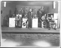 Bob Wills and band [posing on stage]