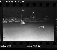 Unknown Rodeo clowns Bull fighting with  Bull #034