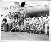 [Group of people preparing to board a Pan American airplane]