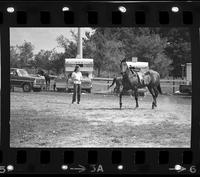 Unidentified Cowgirl with horse