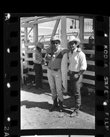 Two unidentified cowboys (one on right possibly Jack Kelly)