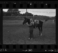 Unidentified Cowgirl with horse