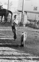 Unidentified young boy practice roping