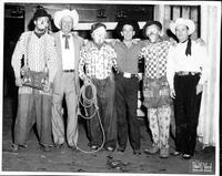 Johnnie Lee Wills with 3 rodeo clowns and 2 cowboys