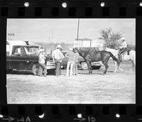 Unidentified group with horses