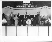 Johnnie Lee Wills and band [band is posing on stage at Cains]