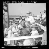 Group in box by microphone, Bill Porter standing