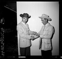 Harry Tompkins receiving Levi Buckle from Wally Raymond