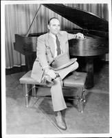Bob Wills posing with piano