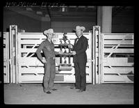 Hoss Inman presenting Hensley Trophy to Alvin Nelson