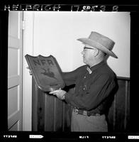 John Van Cronkhite holding Plaque