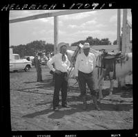 Jiggs & Elra Beutler standing beside Horses