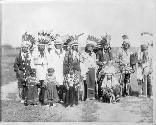 [9 Native American men and 3 Native American children in full dress ...